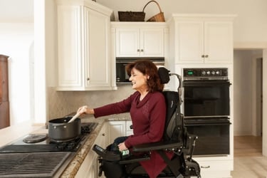APAC - Lady on wheelchair cooking